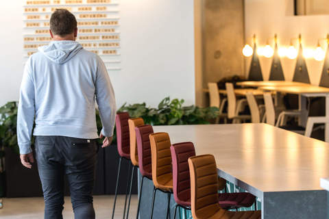 a person standing in a dining room table
