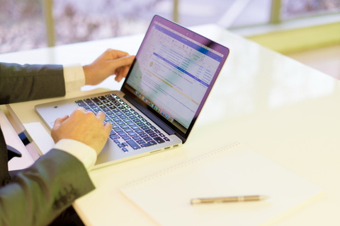 a laptop computer sitting on top of a table