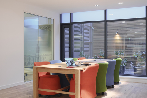 a room filled with furniture and a large window