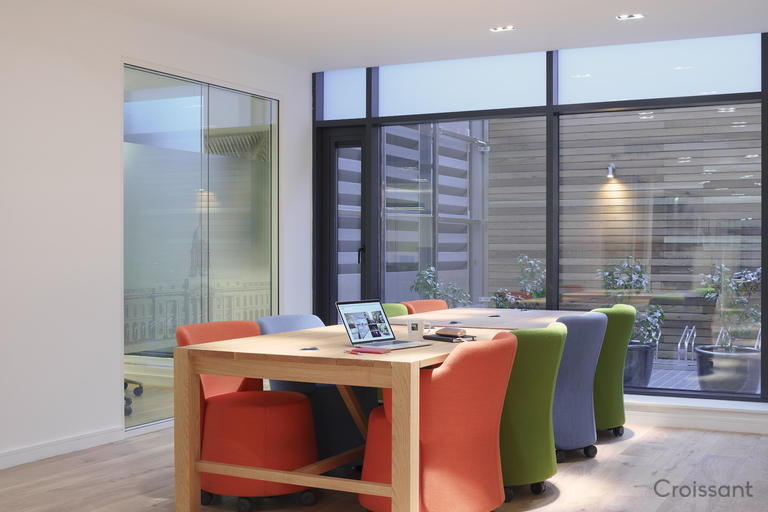 a room filled with furniture and a large window