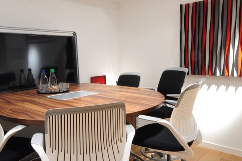 a room with a table and chairs