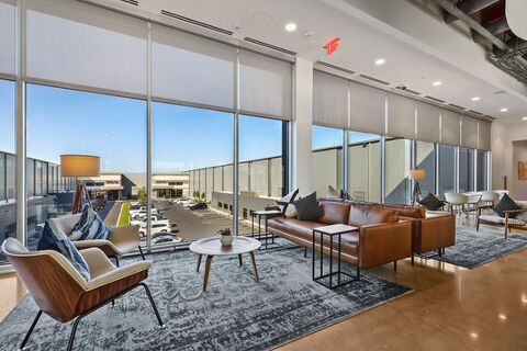 a room filled with furniture and a large window