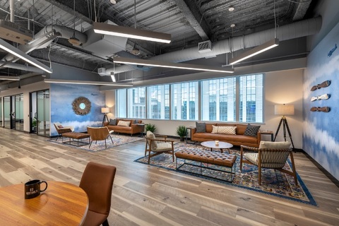 a room filled with furniture and a large window