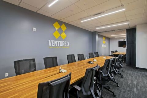 an office with a desk and chair in a room