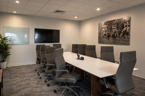 a conference room with a table and chairs