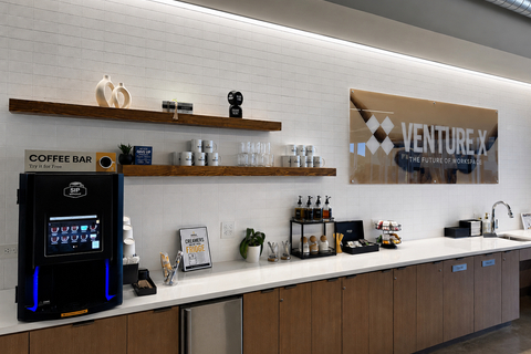 a counter with shelves and a sign on the wall