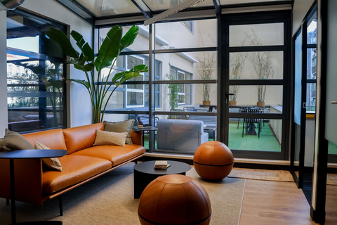 a living room filled with furniture and a large window