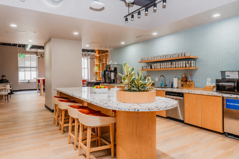 a kitchen with a countertop and stools
