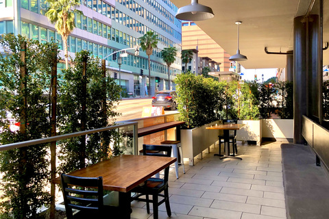 a room filled with furniture and a table in front of a building