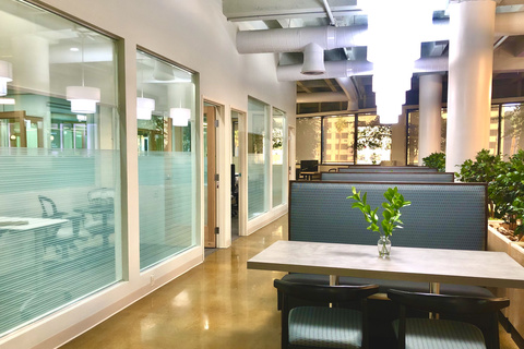 a room filled with furniture and a large window