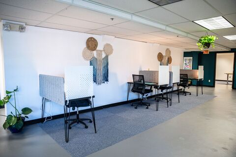 a room with chairs and tables