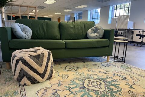 a green couch in a room