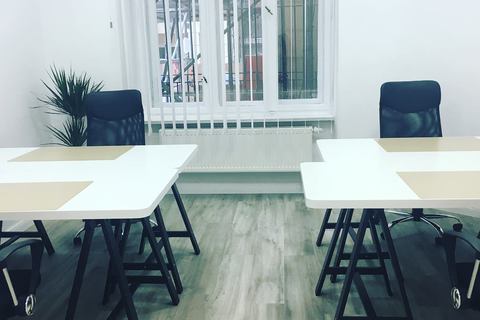 a room filled with furniture and a black chair