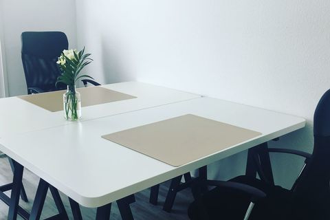 a chair sitting in front of a table