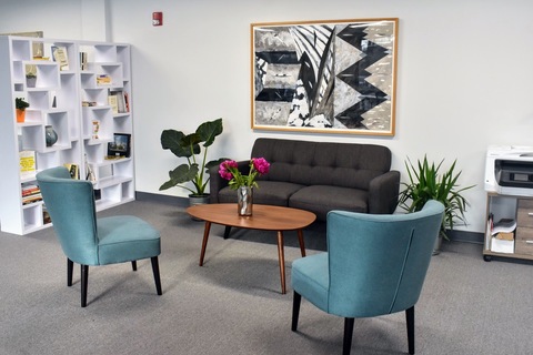 a living room filled with furniture and a table