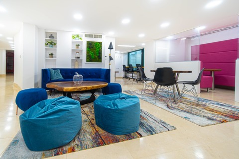 a living room filled with furniture and a flat screen tv