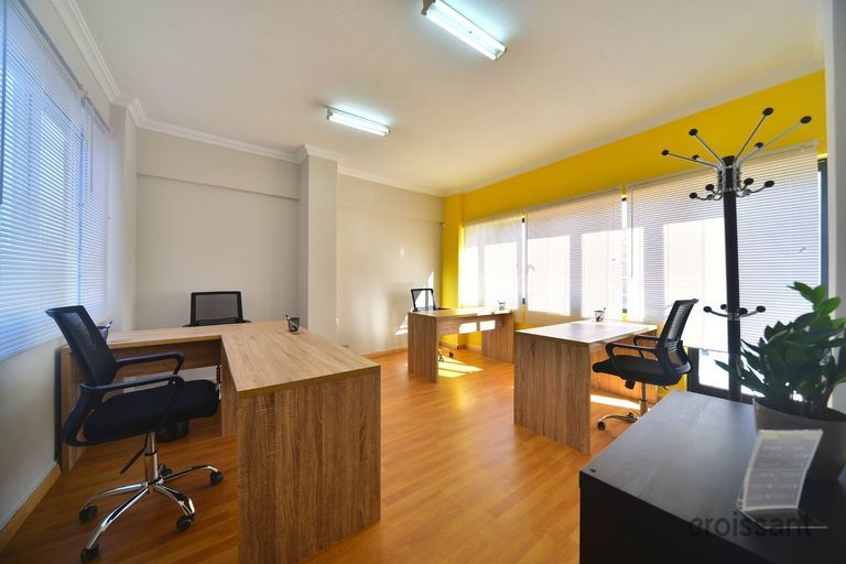 a room with a wooden table