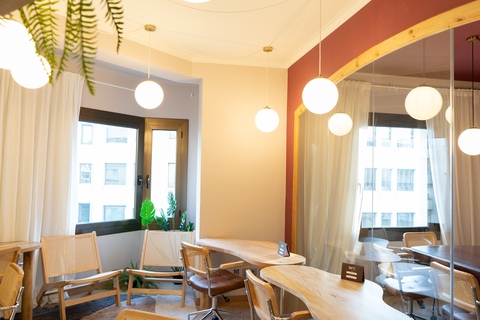 a dining room table in front of a window