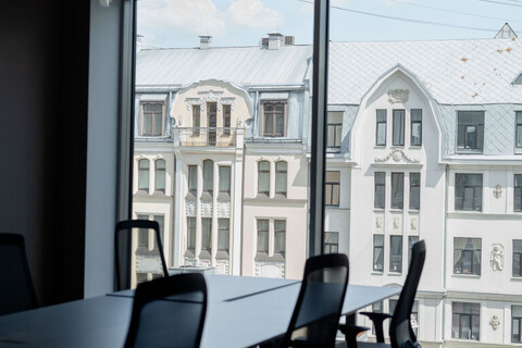 a chair sitting in front of a building