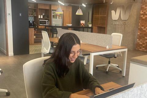 a person sitting at a table in a room