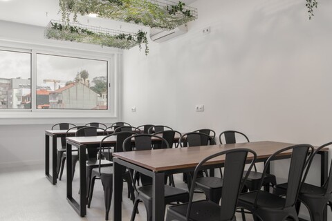 a room with a table and chairs