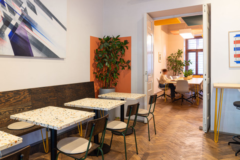 a room with tables and chairs