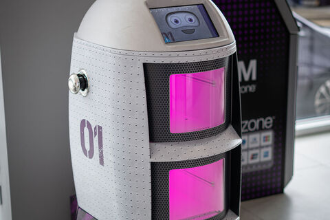 a robot with a pink screen
