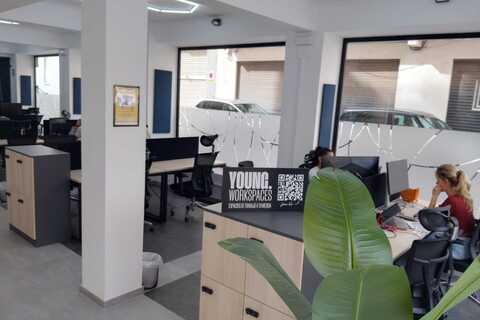 a room with a desk and computer