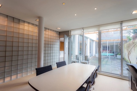 a room with a table and chairs