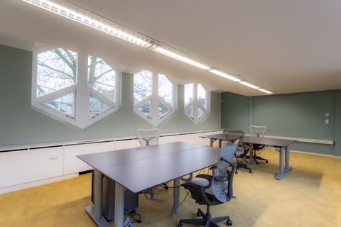 a room with tables and chairs