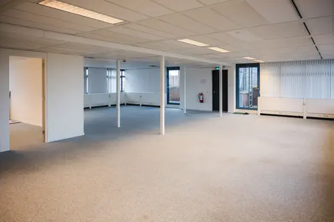 a room with white walls and a door