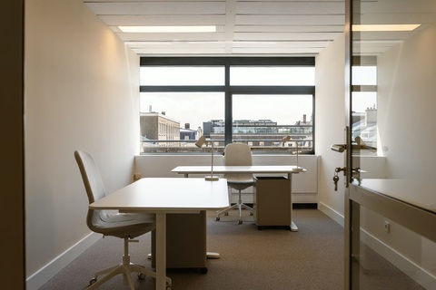 a desk and chair in an office